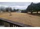 View of backyard with tennis court and trees from deck at 7019 Blue Sky Dr, Locust Grove, GA 30248