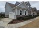 Gray two-story home with a three car garage at 7019 Blue Sky Dr, Locust Grove, GA 30248