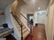 Wooden staircase with carpet steps and railing at 7019 Blue Sky Dr, Locust Grove, GA 30248