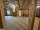 Unfinished basement with exposed framing and a door at 7019 Blue Sky Dr, Locust Grove, GA 30248