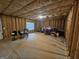 Unfinished basement area with exposed framing and concrete floor at 7019 Blue Sky Dr, Locust Grove, GA 30248