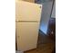 White refrigerator in kitchen with wood flooring at 213 Whippoorwill Way, Riverdale, GA 30274