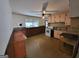 Kitchen with pink cabinets, white appliances, and wood flooring at 213 Whippoorwill Way, Riverdale, GA 30274