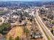 Wide aerial view of the property and surrounding town at 60 N East Main St, Hampton, GA 30228