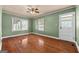 Spacious bedroom with hardwood floors and neutral walls at 60 N East Main St, Hampton, GA 30228