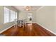 Dining room with hardwood floors and built-in seating at 60 N East Main St, Hampton, GA 30228