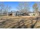 Back of house showing deck and large yard at 60 N East Main St, Hampton, GA 30228