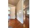 Hardwood floors and built-in shelving in hallway at 60 N East Main St, Hampton, GA 30228