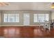 Living room with hardwood floors, large windows, and dining area at 60 N East Main St, Hampton, GA 30228