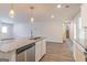 Modern kitchen island with granite countertop and stainless steel dishwasher at 760 Great Oak Pl # 22, Villa Rica, GA 30180