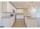 Modern kitchen with white cabinets and granite countertops at 760 Great Oak Pl # 22, Villa Rica, GA 30180