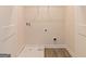 Laundry room with vinyl flooring and built-in shelving at 760 Great Oak Pl # 22, Villa Rica, GA 30180