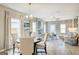 Spacious open-concept area with fireplace, dining, living room and natural light at 1467 Trellis Court (Lot 5), Hampton, GA 30228