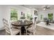 Bright dining area with neutral paint, modern furnishings, and large windows overlooking the backyard at 1479 Trellis Court (Lot 3), Hampton, GA 30228
