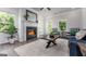 Cozy living room with a fireplace, natural light, and comfortable seating perfect for relaxation at 1479 Trellis Court (Lot 3), Hampton, GA 30228