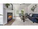 Bright living room with a fireplace, cozy seating, and modern decor for a relaxing atmosphere at 1479 Trellis Court (Lot 3), Hampton, GA 30228