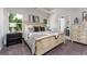 Relaxing primary bedroom features a comfortable bed, soft lighting, and a serene ambiance at 1479 Trellis Court (Lot 3), Hampton, GA 30228