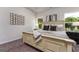 Serene primary bedroom offers a cozy bed, natural light, and a tranquil retreat at 1479 Trellis Court (Lot 3), Hampton, GA 30228