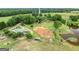 Aerial view of a large property with a house, pond, and barn at 241 Hosannah Rd, Locust Grove, GA 30248