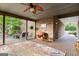 Relaxing screened porch with ceiling fan and comfortable seating at 241 Hosannah Rd, Locust Grove, GA 30248