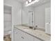 Bright bathroom with granite vanity top, white cabinets, and full size mirror at 5626 Wyncreek Sw Cir, South Fulton, GA 30331