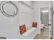 Charming foyer with built-in bench seating, decorative pillows, and stylish mirror accent at 5626 Wyncreek Sw Cir, South Fulton, GA 30331