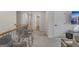 Second floor hallway with decorative railing, plush carpet, and access to living room at 5626 Wyncreek Sw Cir, South Fulton, GA 30331