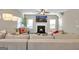 Bright living room with plush sectional sofa, fireplace, and flatscreen TV for relaxing evenings at 5626 Wyncreek Sw Cir, South Fulton, GA 30331