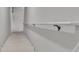 White staircase leading downstairs with simple design and white walls at 5626 Wyncreek Sw Cir, South Fulton, GA 30331