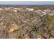Wide aerial view of suburban neighborhood with tree cover at 8806 Clear Creek Ct, Douglasville, GA 30135