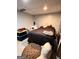 Cozy basement bedroom with a double bed and additional floor pillows at 8806 Clear Creek Ct, Douglasville, GA 30135