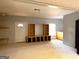 Finished basement featuring built-in shelving and carpeting at 8806 Clear Creek Ct, Douglasville, GA 30135