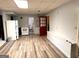 Basement kitchenette with white appliances and wood flooring at 8806 Clear Creek Ct, Douglasville, GA 30135