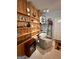 Cozy basement room features built-in shelving and a comfortable armchair at 8806 Clear Creek Ct, Douglasville, GA 30135