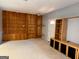 Finished basement with built-in shelving and carpeting at 8806 Clear Creek Ct, Douglasville, GA 30135
