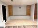 Finished basement with display cases and built-in seating at 8806 Clear Creek Ct, Douglasville, GA 30135