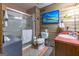 Bathroom with a shower and wood-paneled walls at 8806 Clear Creek Ct, Douglasville, GA 30135