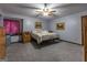 Spacious bedroom with a comfortable bed and ceiling fan at 8806 Clear Creek Ct, Douglasville, GA 30135