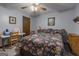 Bright bedroom with floral bedding and ceiling fan at 8806 Clear Creek Ct, Douglasville, GA 30135