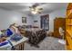 Bedroom with floral bedding, ceiling fan, and built-in shelving at 8806 Clear Creek Ct, Douglasville, GA 30135