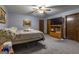 Primary bedroom with large TV and ample closet space at 8806 Clear Creek Ct, Douglasville, GA 30135