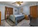 Bright bedroom with double bed and wood closet doors at 8806 Clear Creek Ct, Douglasville, GA 30135