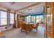 Sunlit dining area with wood furniture and window views at 8806 Clear Creek Ct, Douglasville, GA 30135