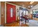 Entryway with red door, piano, and parquet flooring at 8806 Clear Creek Ct, Douglasville, GA 30135