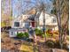 Two-story house with wood siding, multiple windows, and a deck at 8806 Clear Creek Ct, Douglasville, GA 30135
