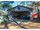 Detached garage with golf cart and various storage items at 8806 Clear Creek Ct, Douglasville, GA 30135