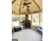 Cozy screened gazebo featuring a brick fireplace and comfortable bench seating at 8806 Clear Creek Ct, Douglasville, GA 30135