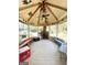 Gazebo with a fireplace, ceiling fan, and wooden benches at 8806 Clear Creek Ct, Douglasville, GA 30135