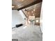 Open living room featuring a stone fireplace, wood ceilings, and plush carpeting at 8806 Clear Creek Ct, Douglasville, GA 30135