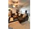 Spacious living room with sectional sofa and view into kitchen at 8806 Clear Creek Ct, Douglasville, GA 30135